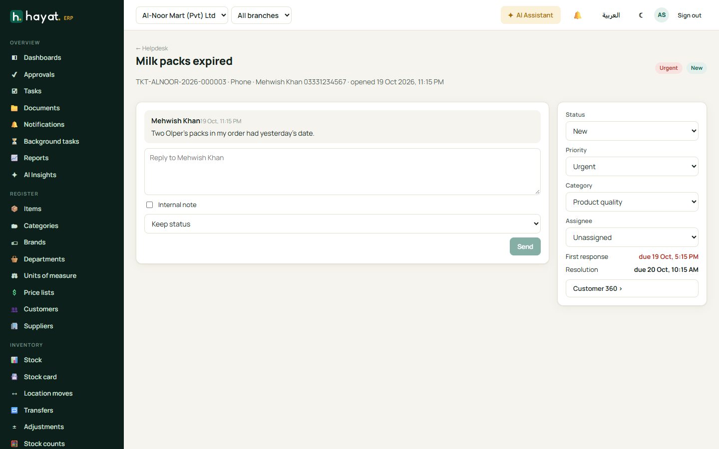 A ticket: the conversation on the left, status, priority, category and assignee on the right